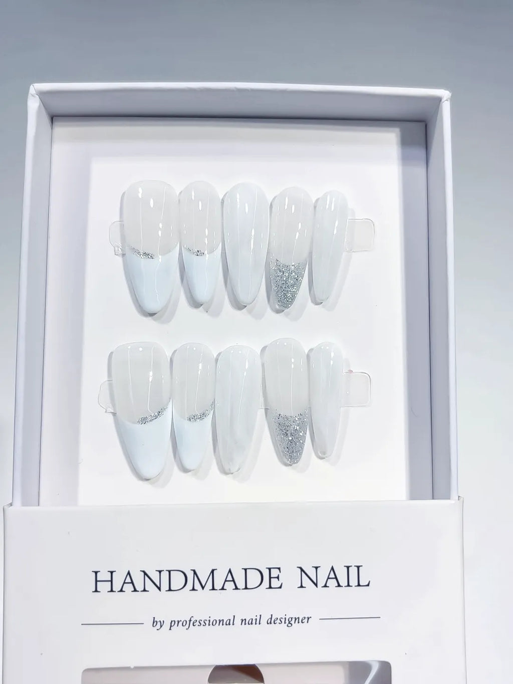 long almond white french handmade press on nails with silver glitter lines, close-up top row