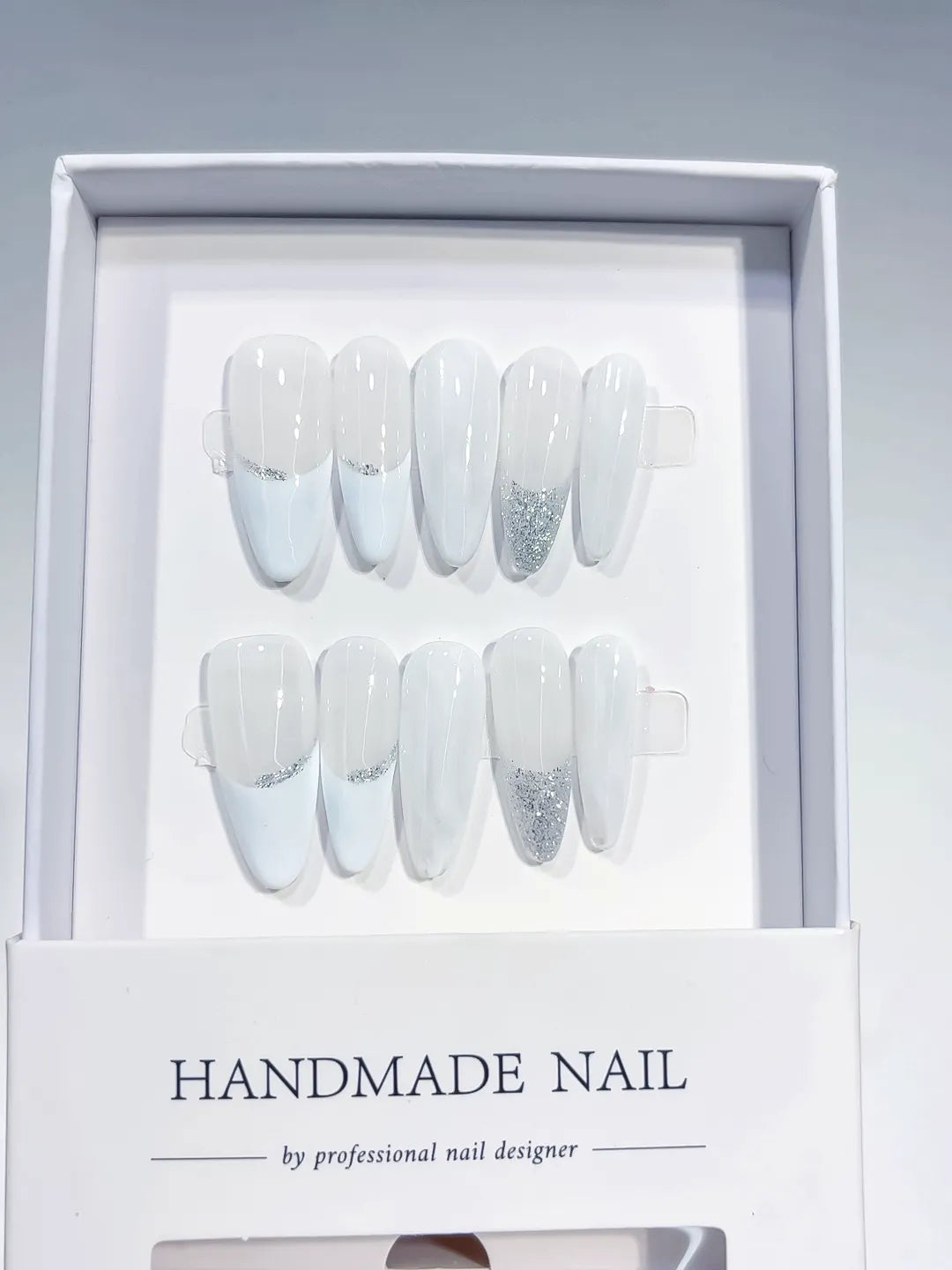 long almond white french handmade press on nails with silver glitter lines, close-up top row