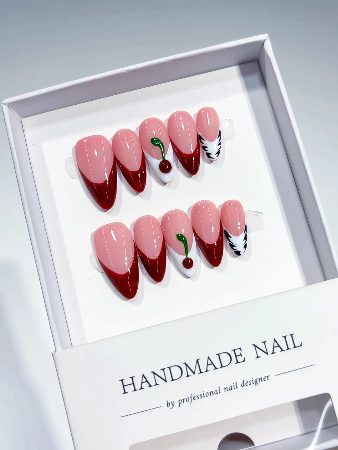 Pink Red White French tip Cherry Leaf press on nails angled view