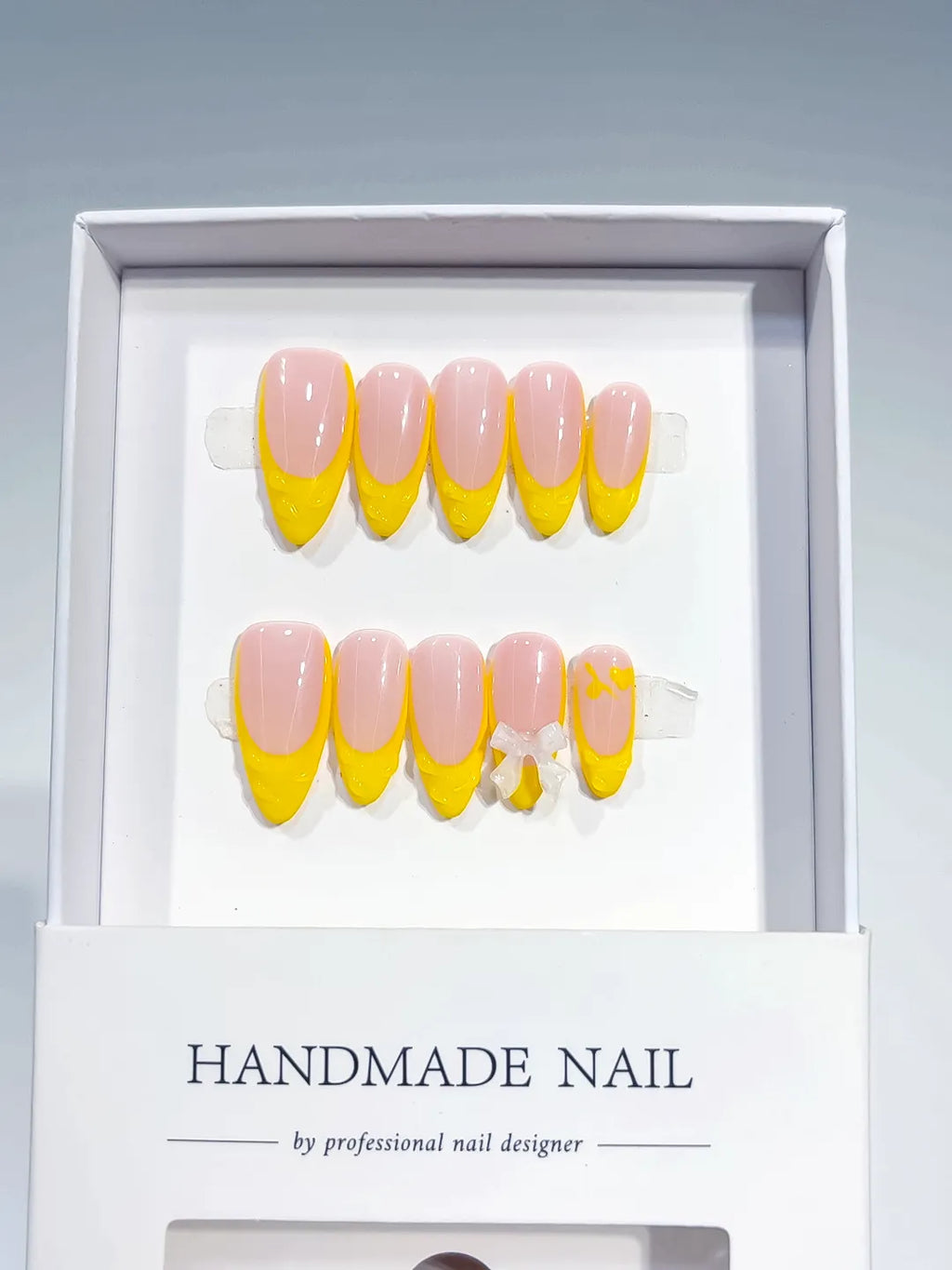Nude Yellow French tip Bow press on nails full set view