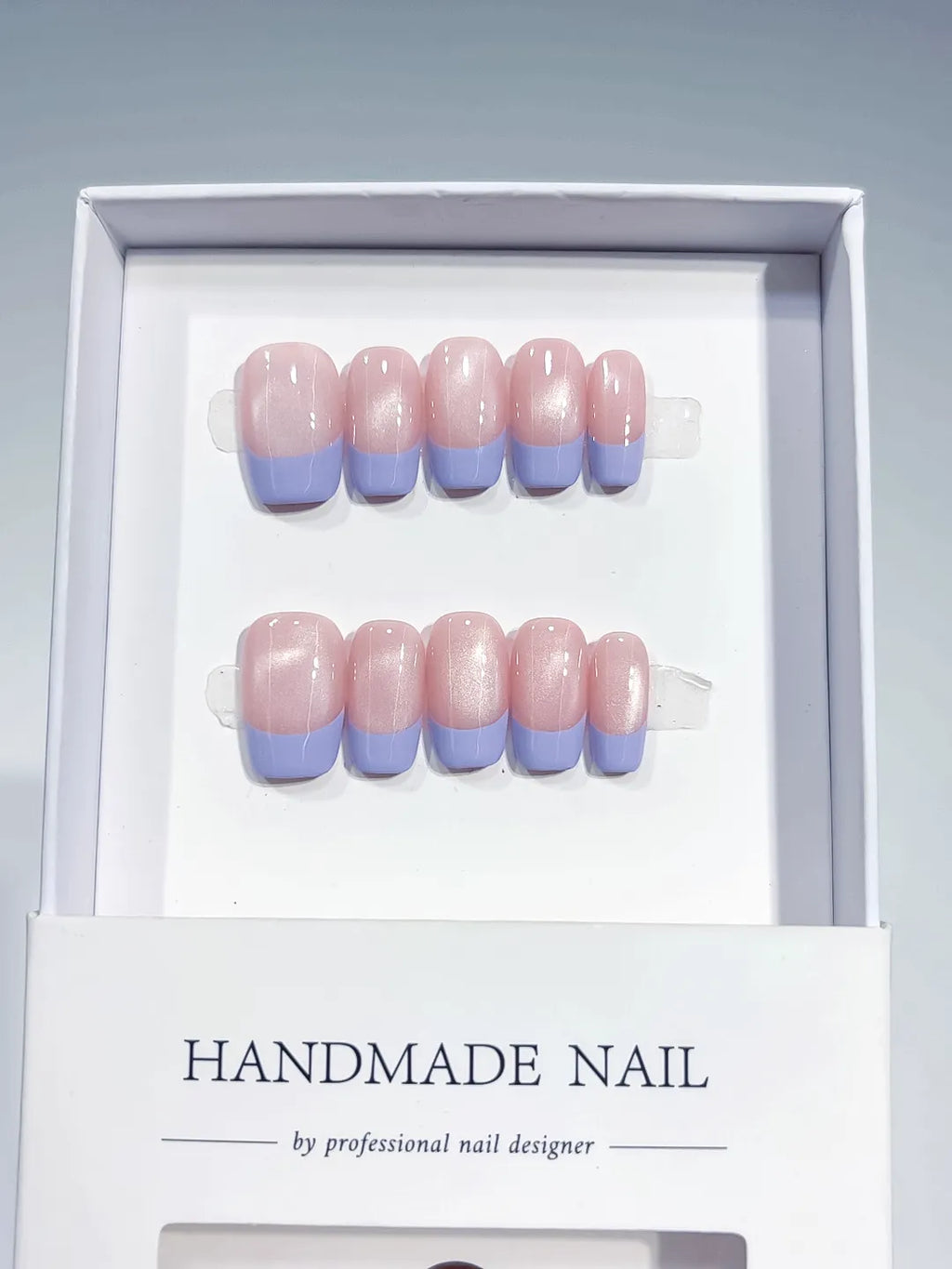 Pink Purple French tip Pearl Sheen press on nails angled view