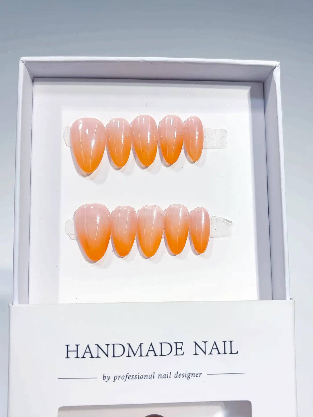 Nude Orange Ombre press on nails angled view