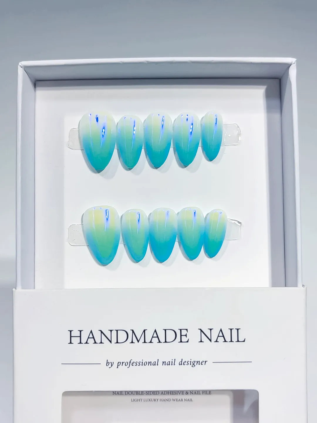 Blue Green Yellow Ombre press on nails angled view