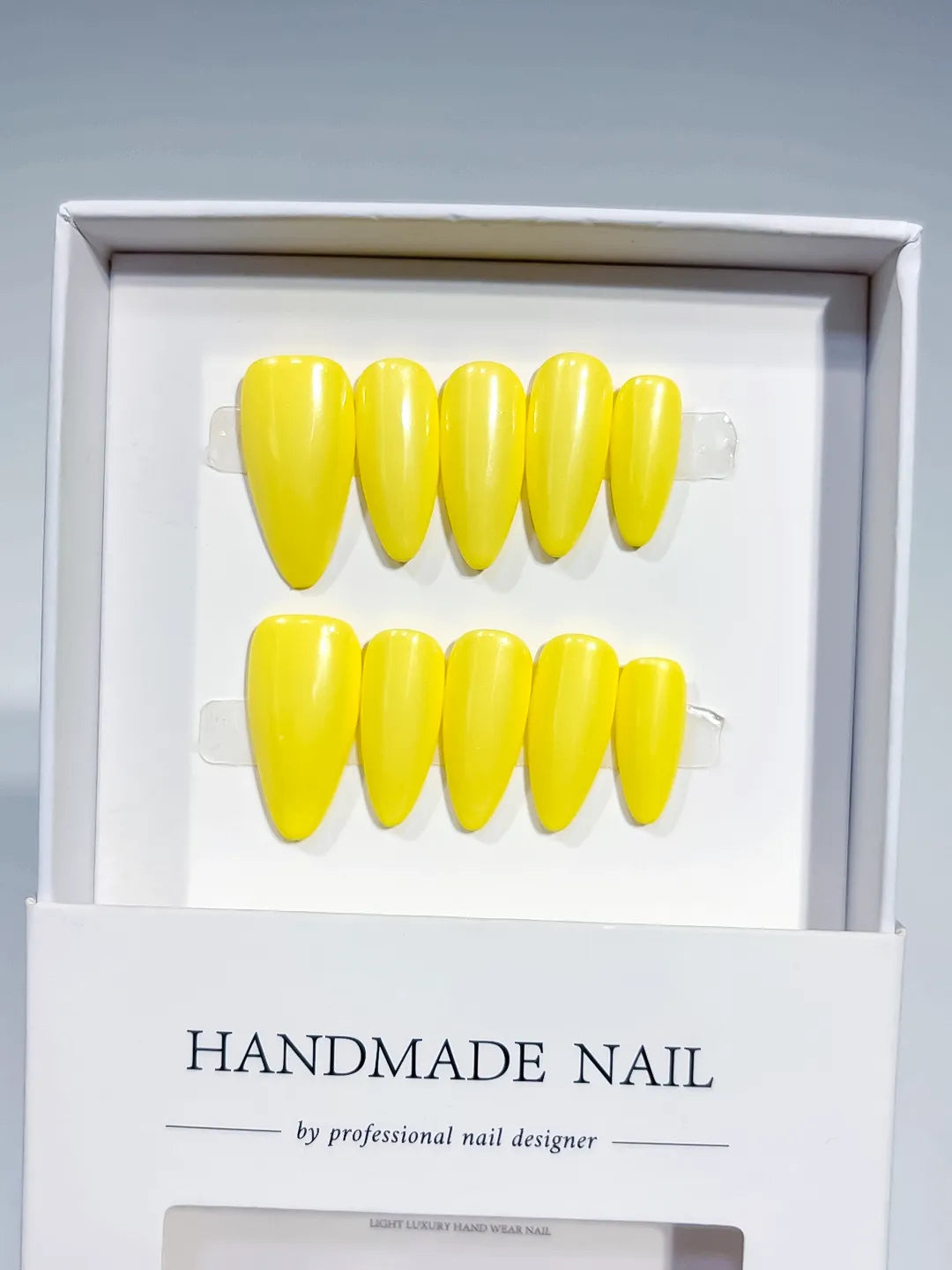 Yellow Solid color press on nails angled view