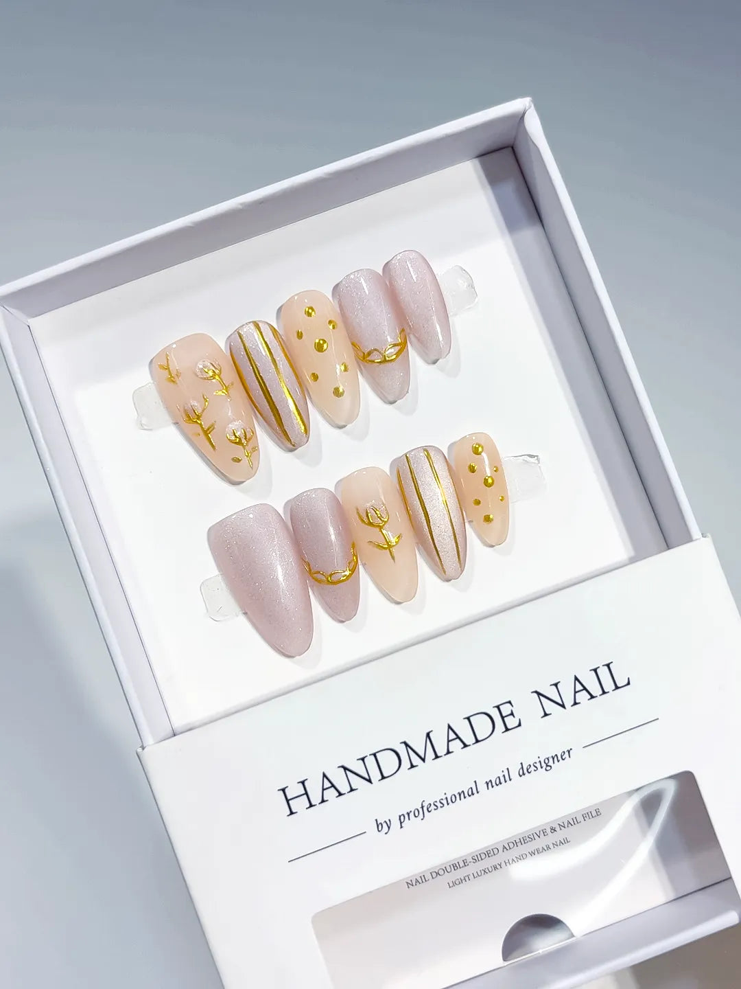 Nude White Gold Abstract Gold Line Gold Stud press on nails angled view