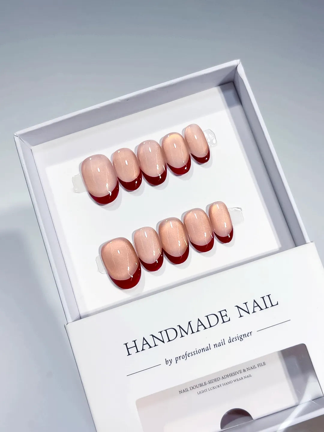 Nude Red Multicolor French tip Aurora Sheen press on nails angled view