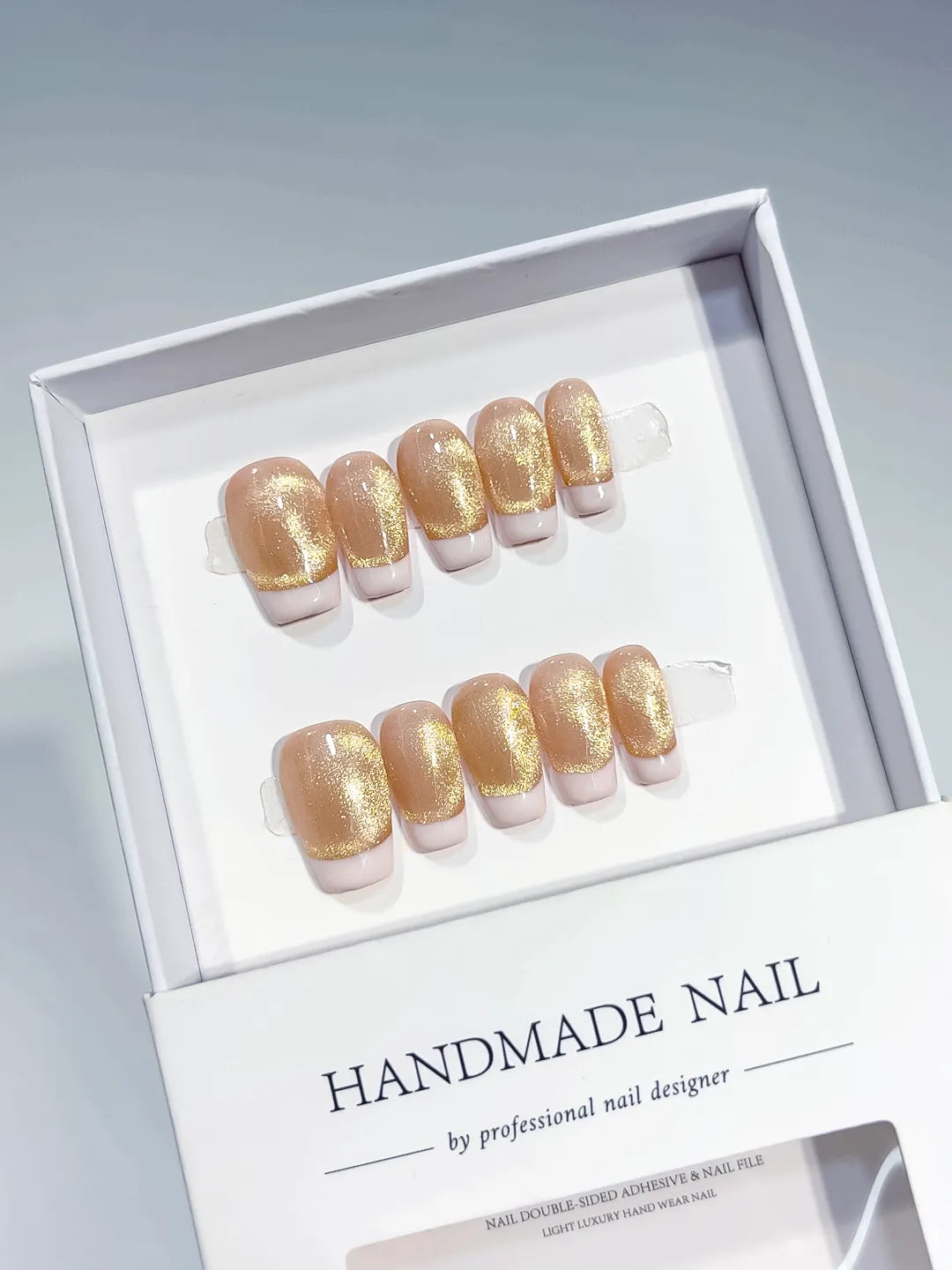 Nude Gold White French tip press on nails angled view