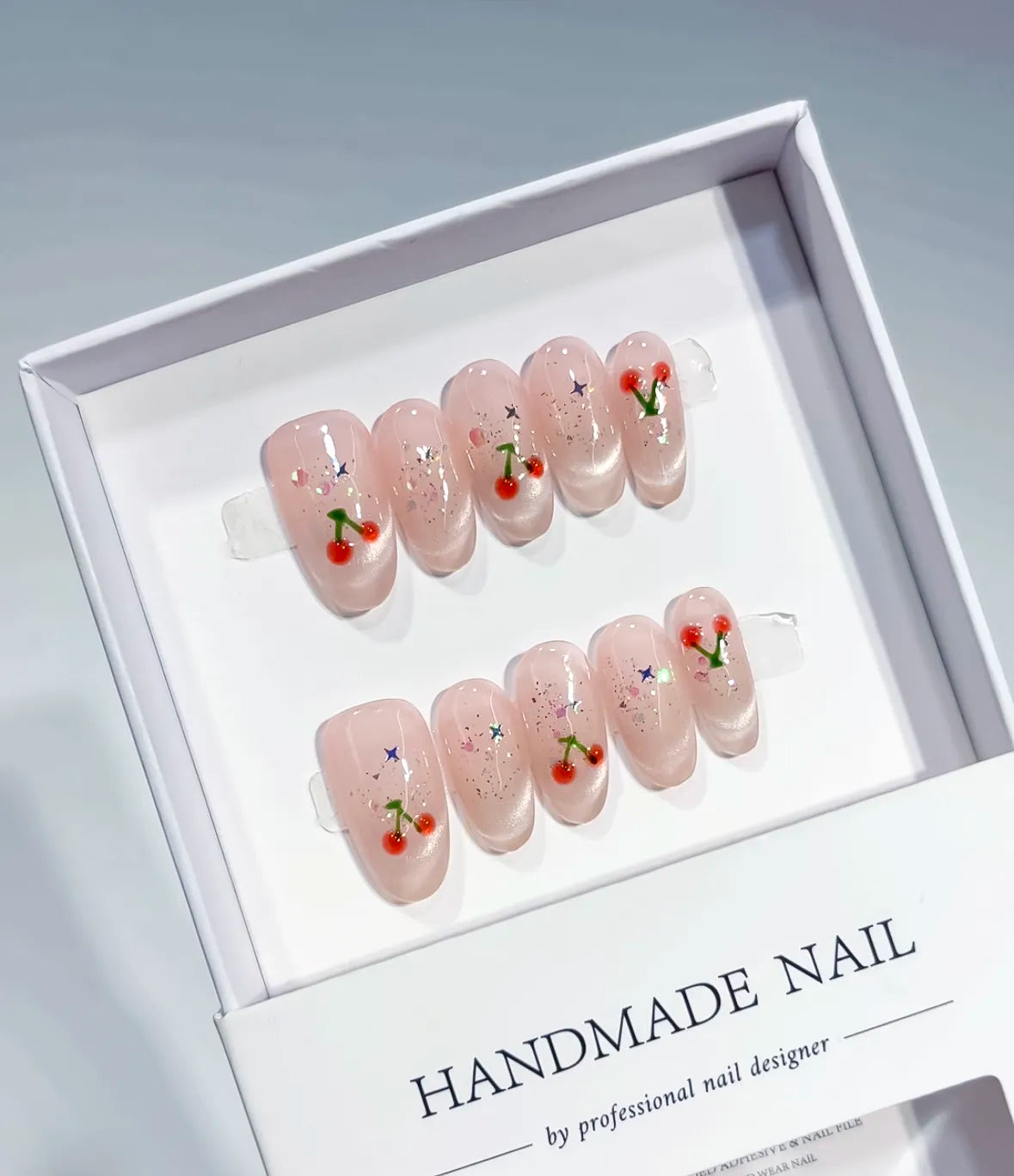 Nude Pink Solid color Cherry Glitter press on nails angled view