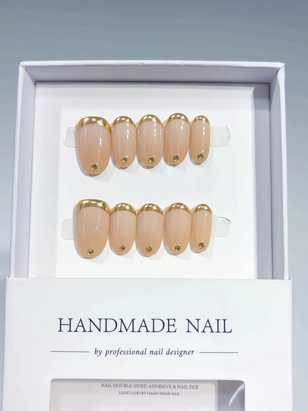 Nude Gold French tip Rhinestone press on nails angled view