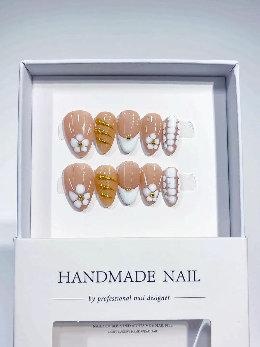 Handmade press on nails short almond nude with 3D flowers centerpiece view