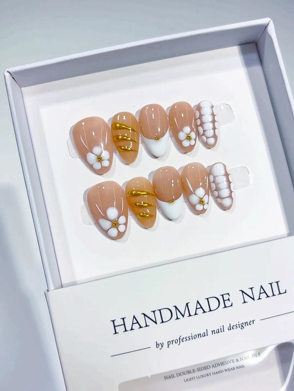 Handmade press on nails short almond nude with 3D flowers centerpiece view