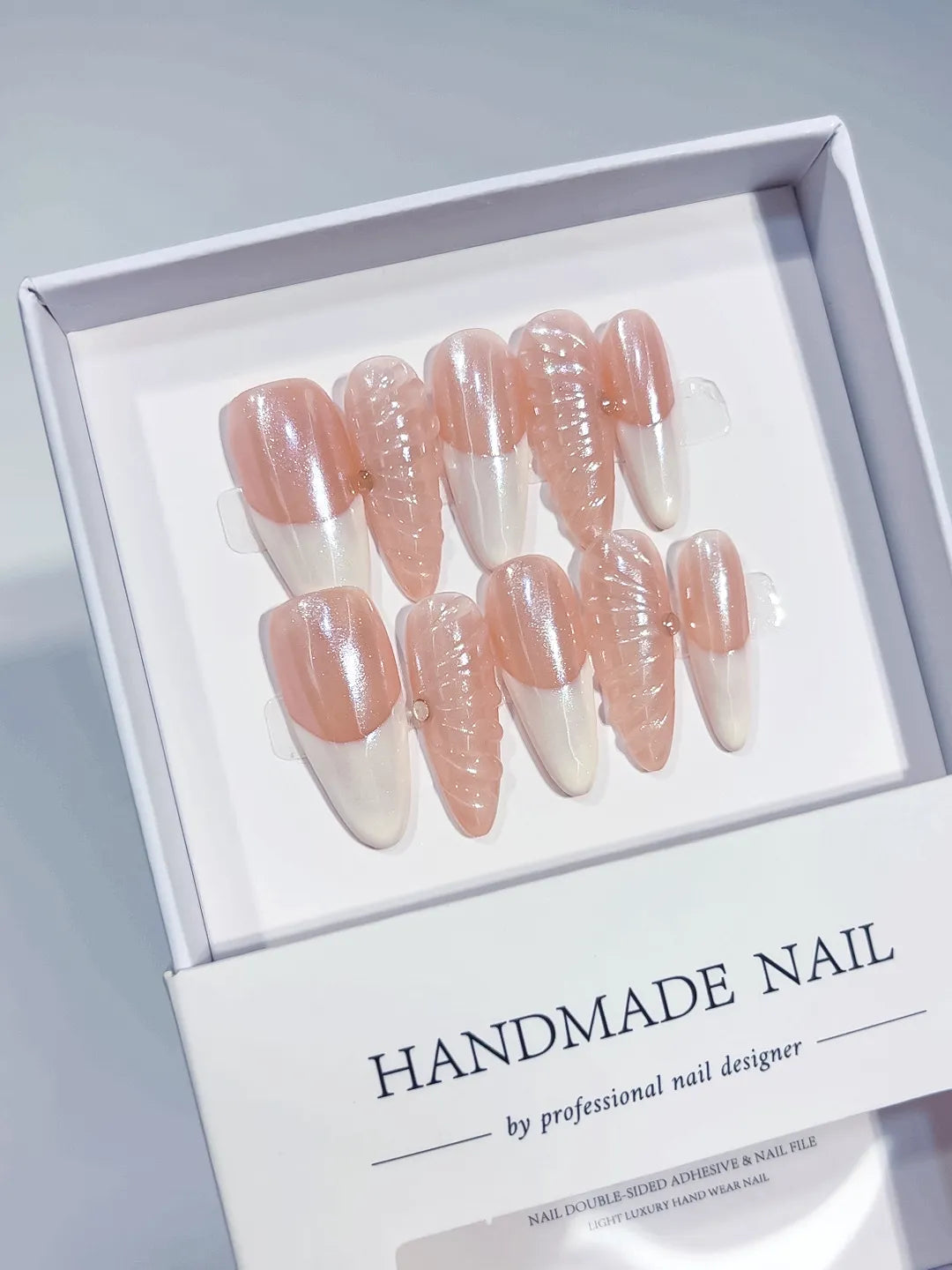 Long almond nude pink handmade press on nails with 3D swirl centerpiece