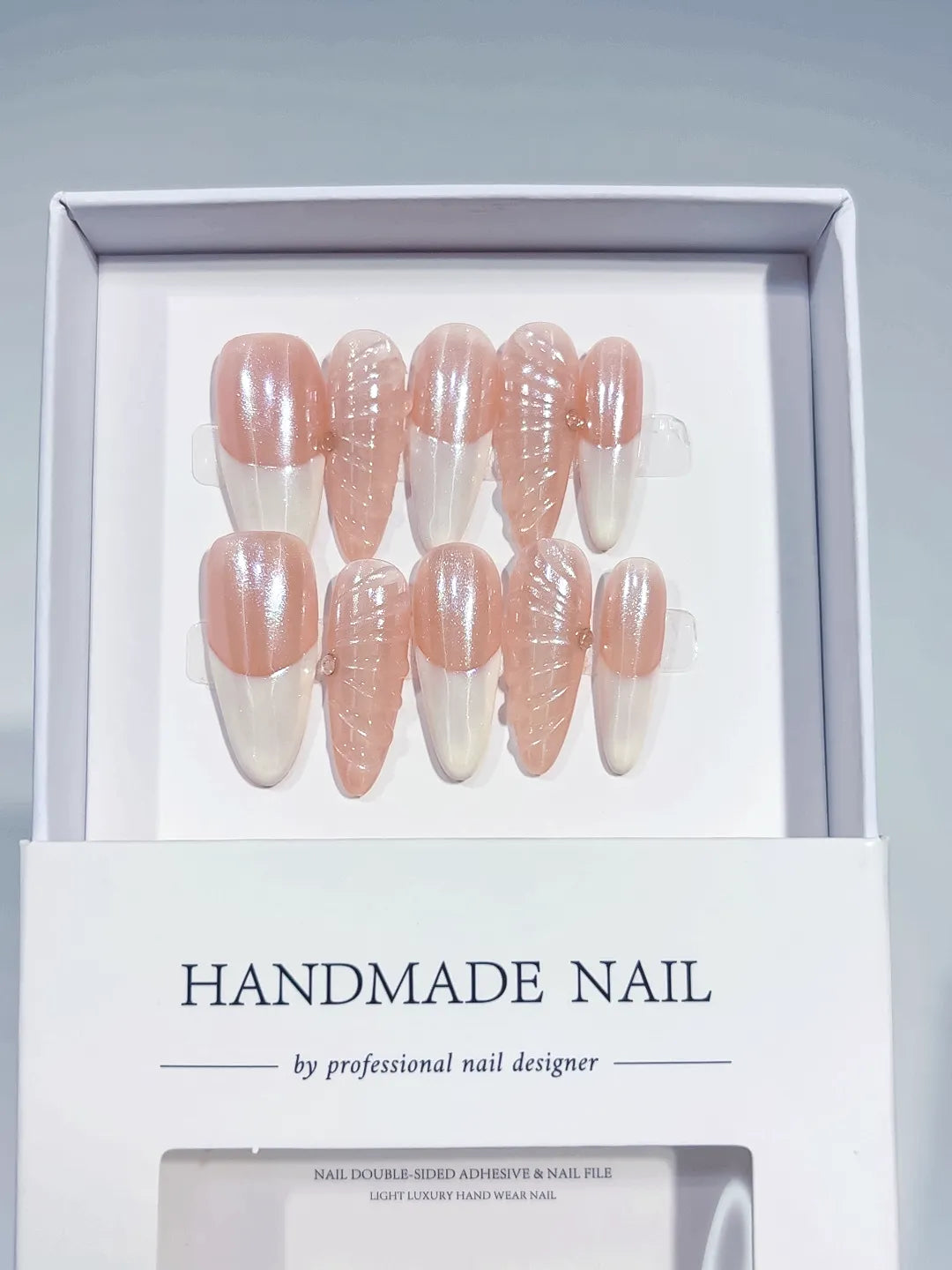 Long almond nude pink handmade press on nails with 3D swirl centerpiece