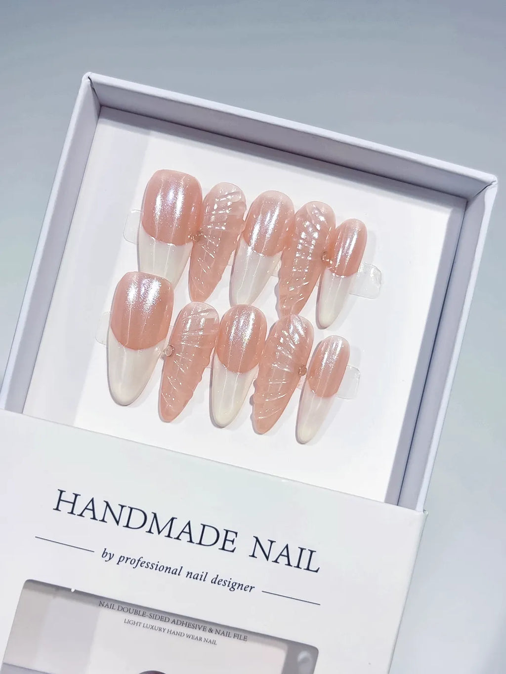 Long almond nude pink handmade press on nails with 3D swirl centerpiece