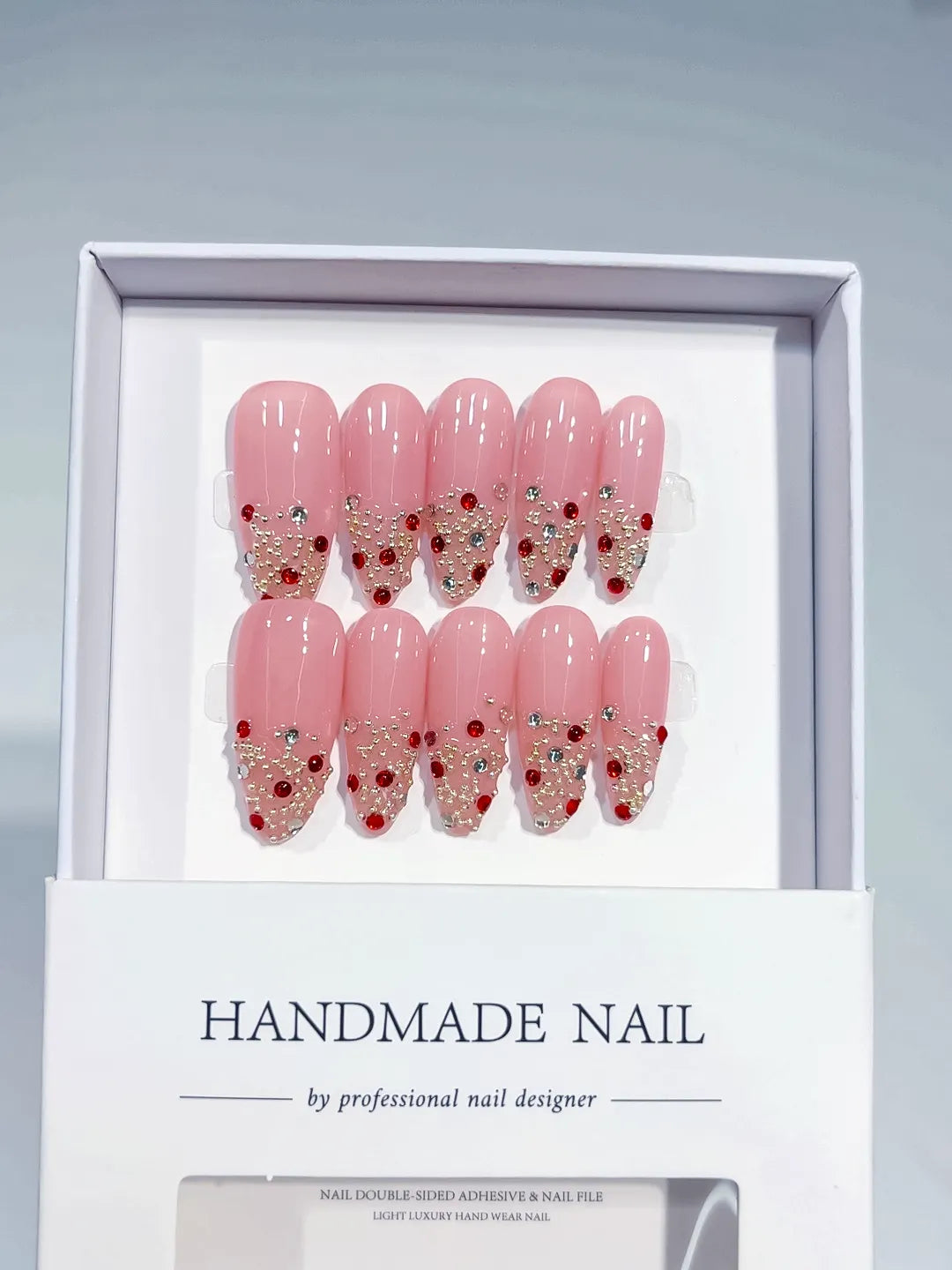 Handmade press on nails long almond pink glitter with rhinestones centerpiece view