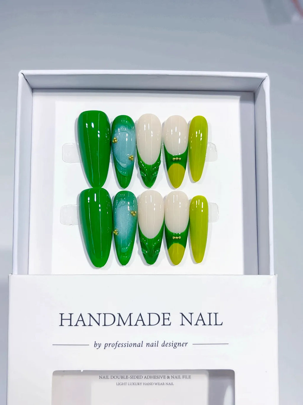 Handmade press on nails long almond green with 3D swirl and bead accents centerpiece view