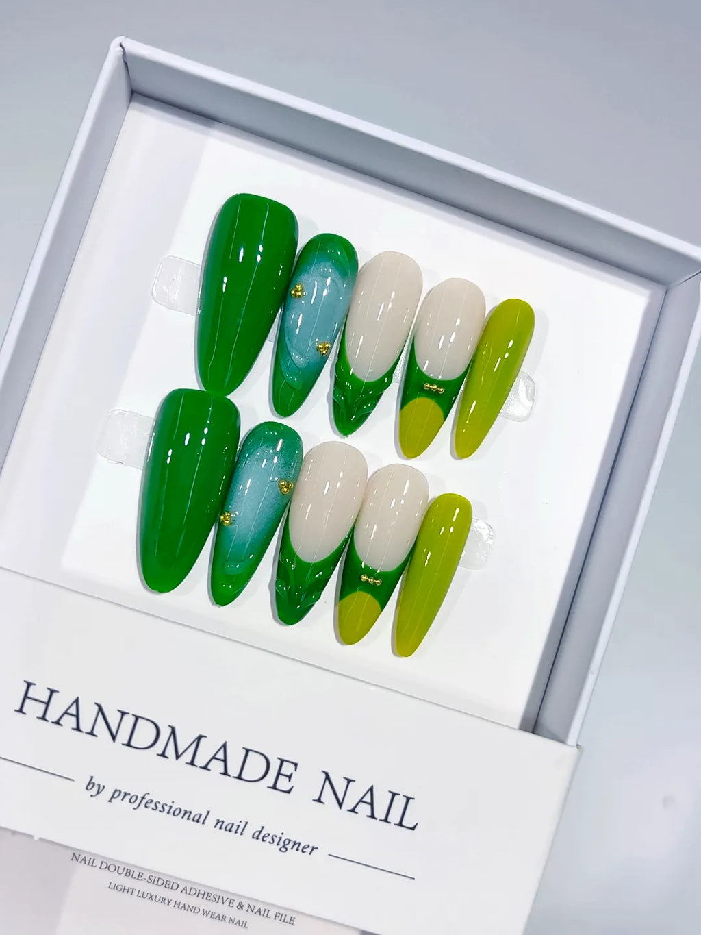 Handmade press on nails long almond green with 3D swirl and bead accents centerpiece view