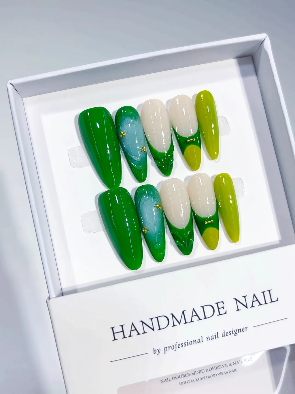 Handmade press on nails long almond green with 3D swirl and bead accents centerpiece view