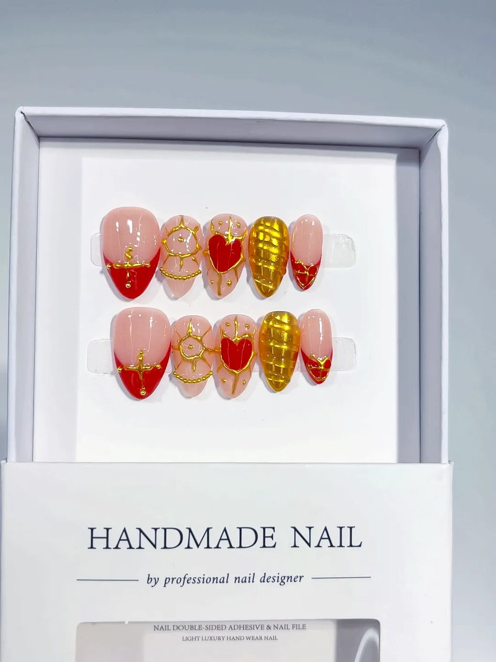 Handmade press on nails short almond nude with red hearts and gold glitter centerpiece