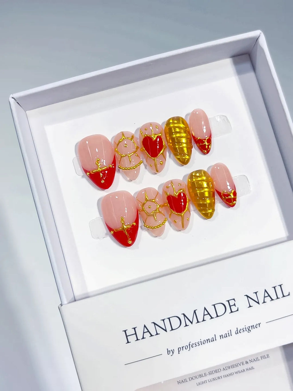 Handmade press on nails short almond nude with red hearts and gold glitter centerpiece