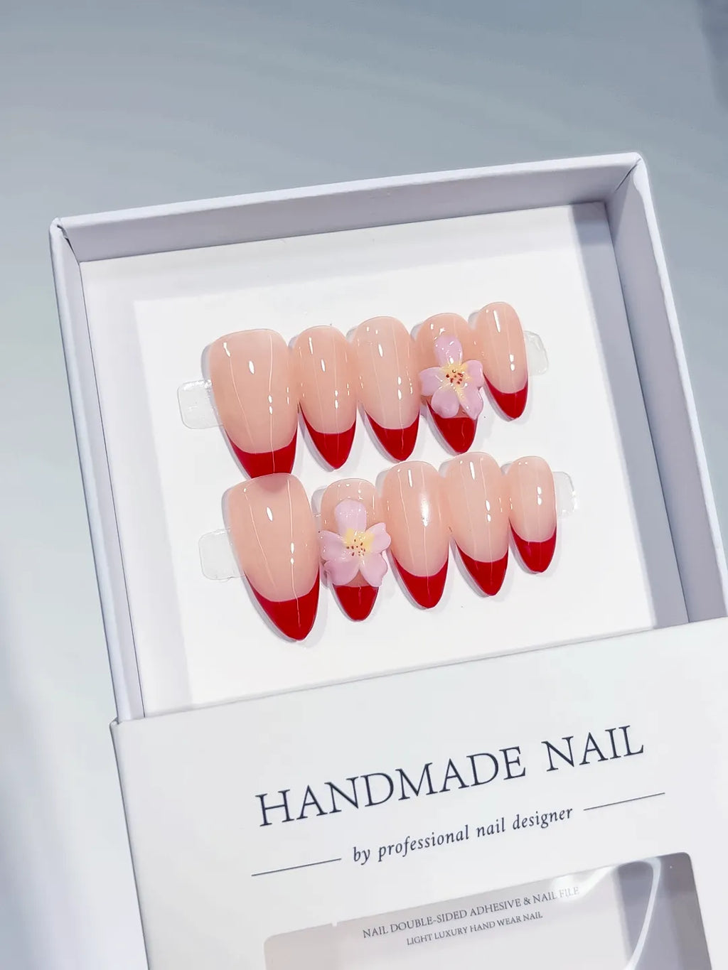 Nude Red Pink French tip Flower press on nails angled view