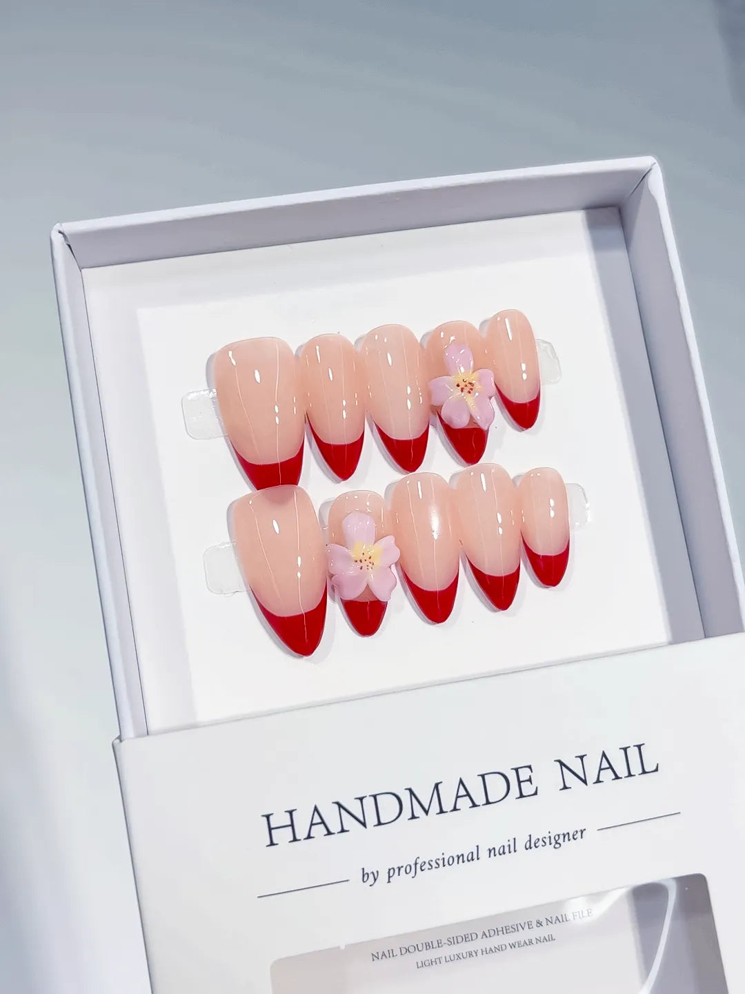 Nude Red Pink French tip Flower press on nails angled view