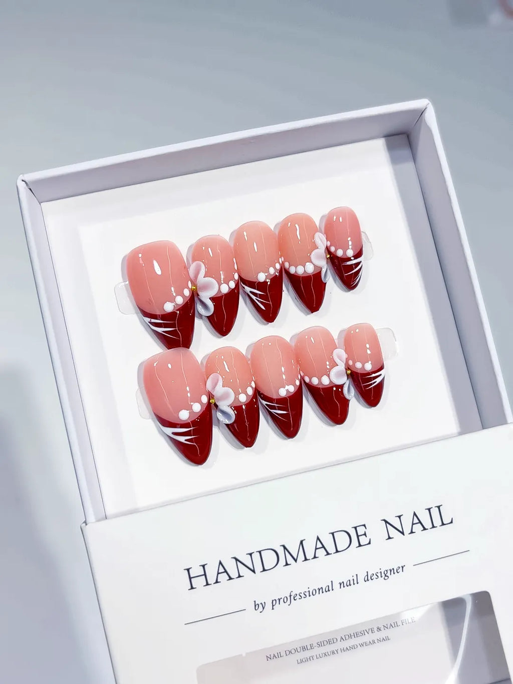 Nude Red White French tip Flower Pearl Line press on nails angled view