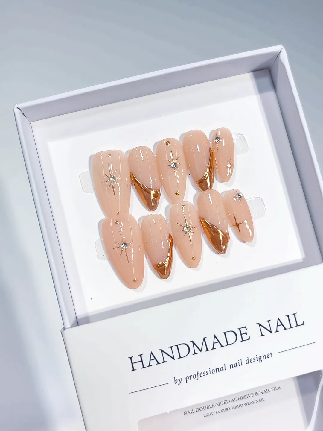 Nude Gold Metallic Star Rhinestone press on nails angled view