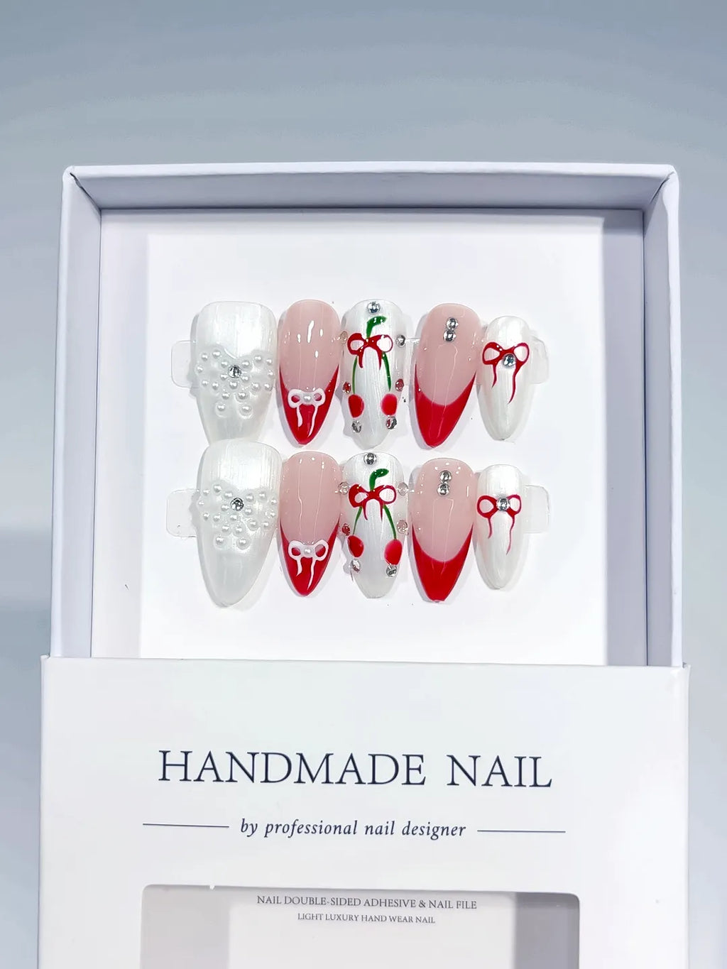 White Red Nude French tip Bow Cherry Pearl press on nails angled view