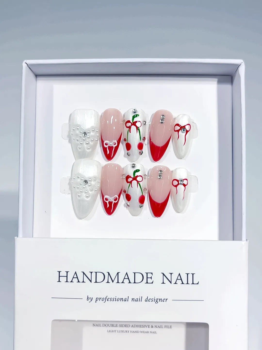 White Red Nude French tip Bow Cherry Pearl press on nails angled view