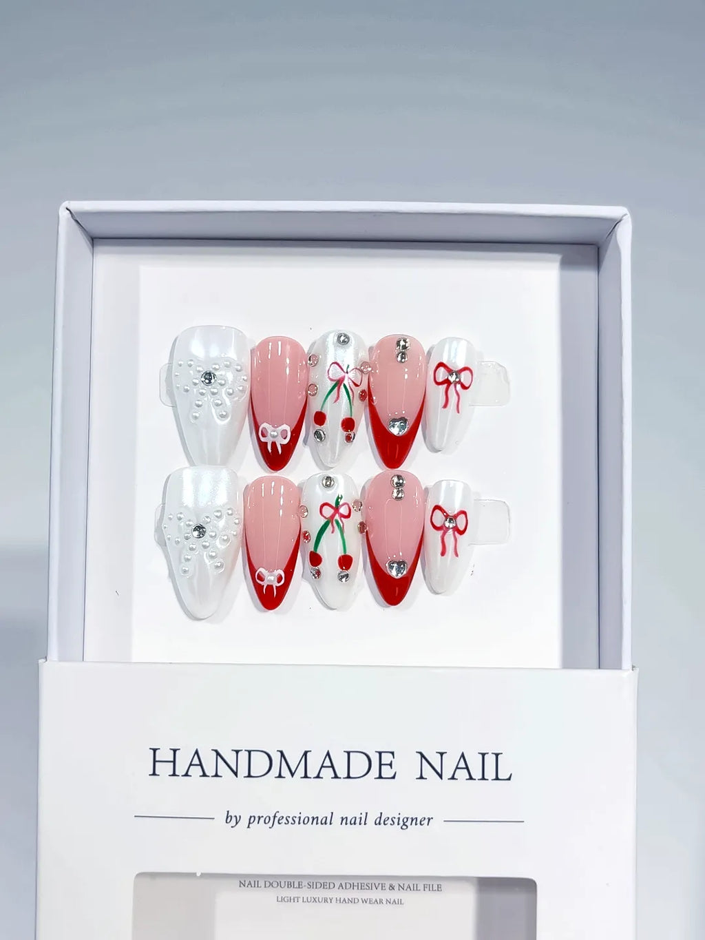 White Red Nude French tip Bow Cherry Pearl press on nails angled view