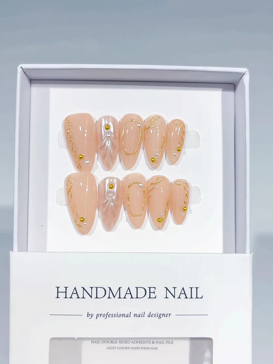 Nude Gold Silver Abstract Pearl Gold Line Gold Stud press on nails angled view