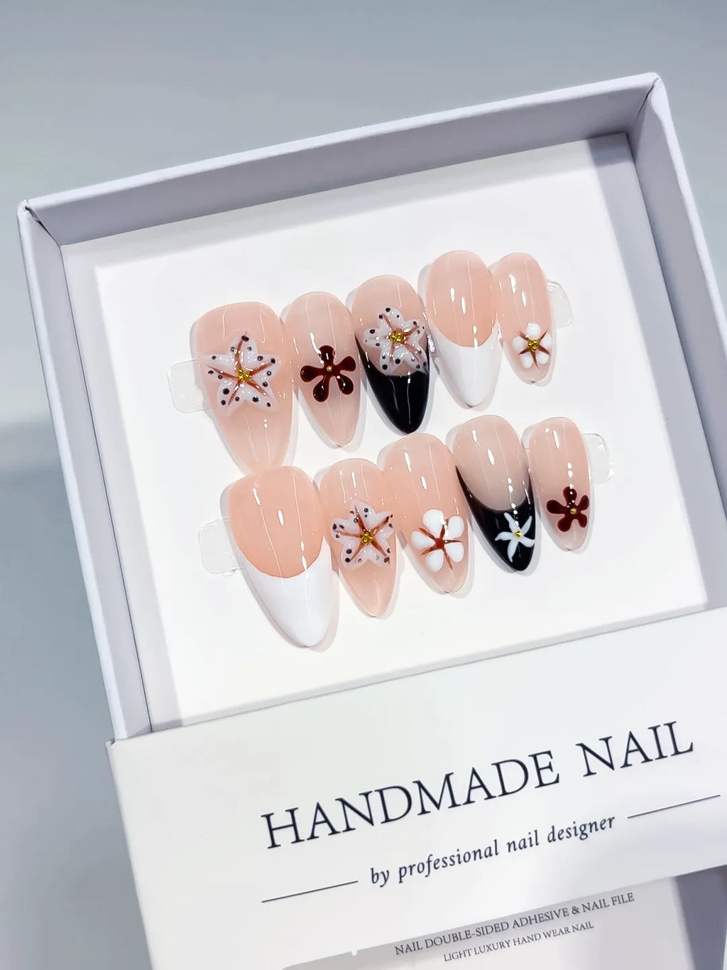 Nude Black White Brown Gold French tip Flower Star press on nails angled view