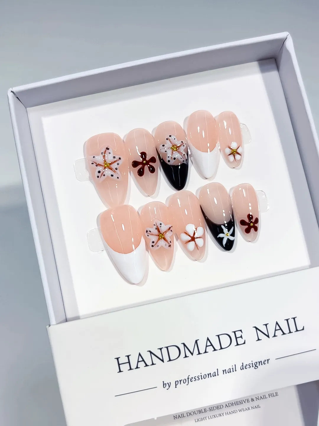 Nude Black White Brown Gold French tip Flower Star press on nails angled view
