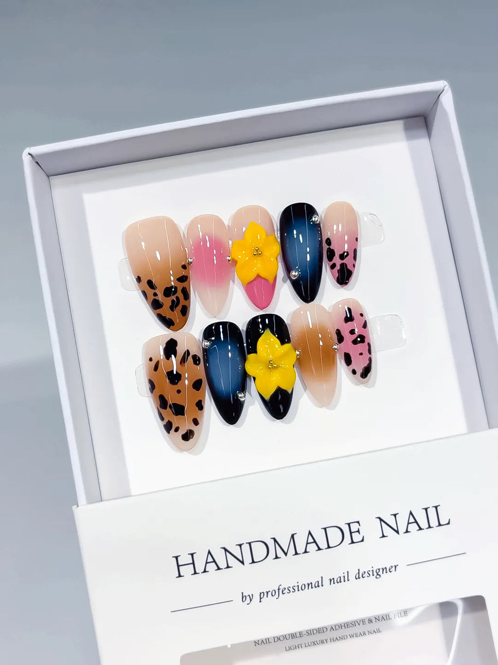 Nude Brown Pink Blue Black Abstract Flower Animal Print press on nails angled view