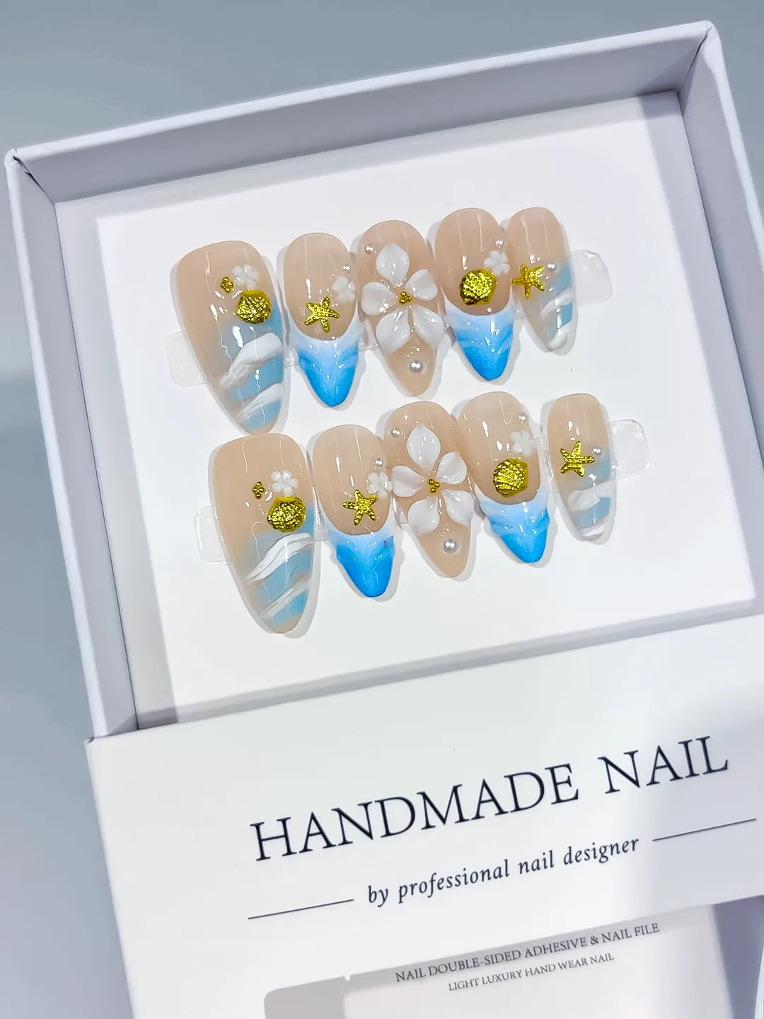 Nude Blue White Gold French tip Flower Star Shell press on nails angled view
