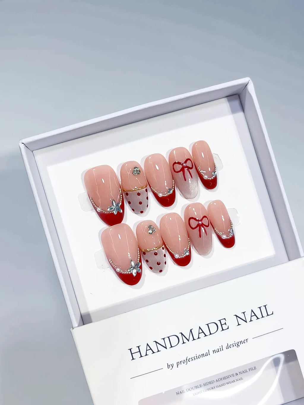 Nude Red Silver French tip Bow Polka Dot Butterfly press on nails angled view