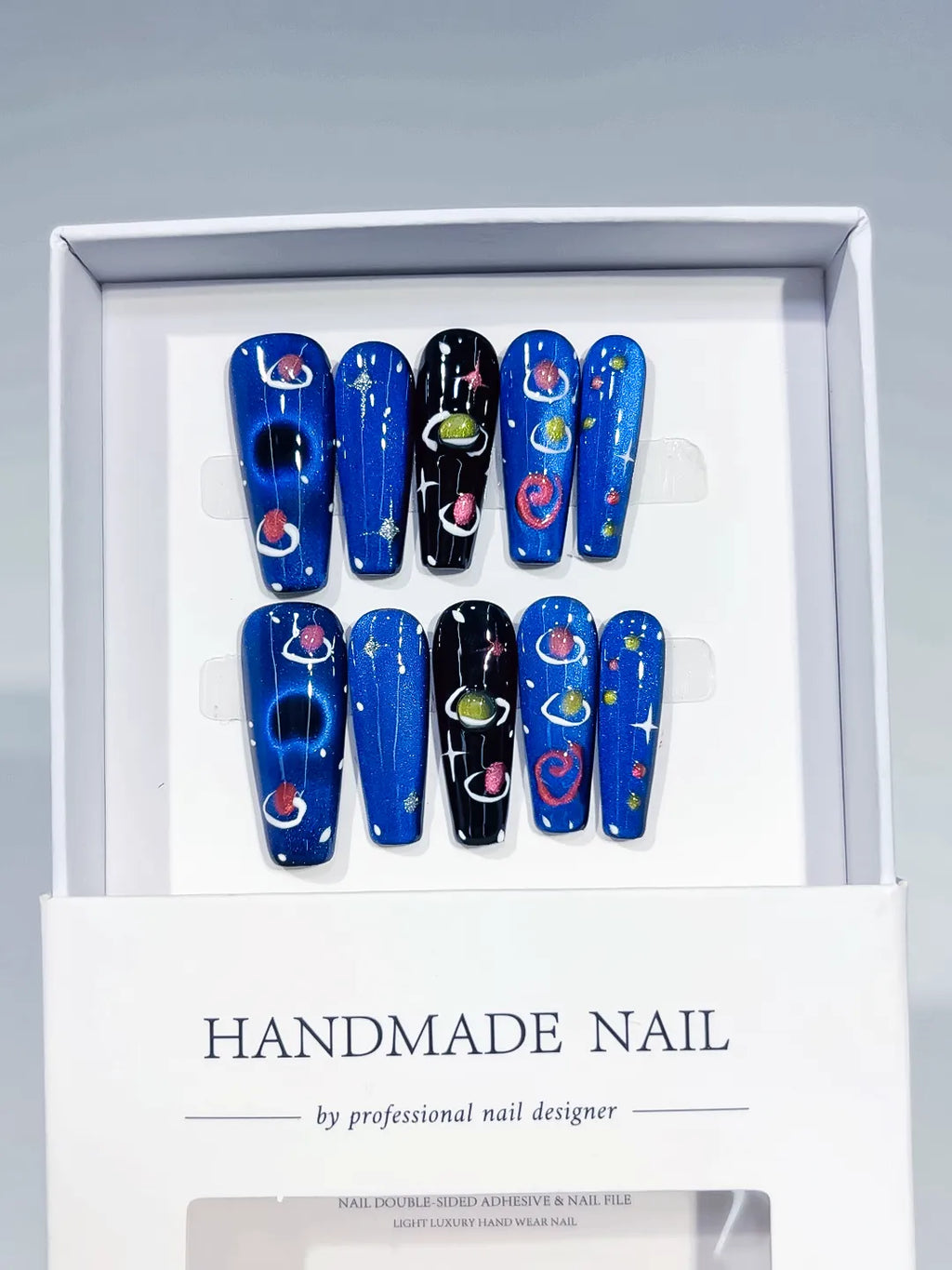 Blue Black Multicolor Abstract Planet Star press on nails angled view