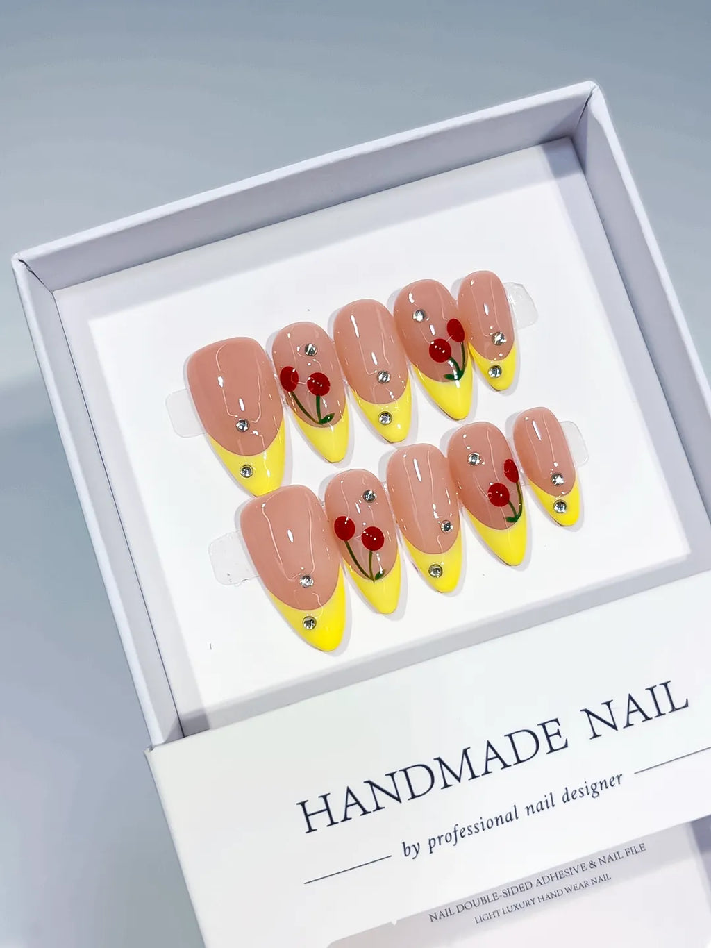 Nude Yellow Red French tip Cherry Rhinestone press on nails full set view