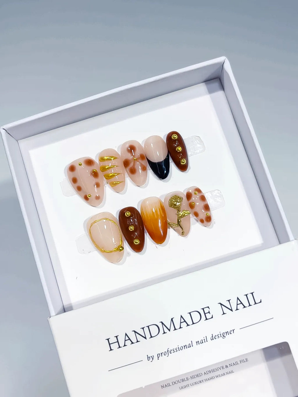 Nude Brown Gold Abstract Gold Line Gold Stud Floral press on nails angled view