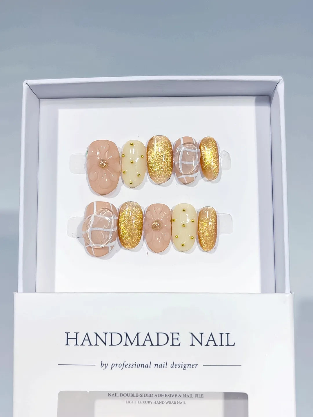 Nude White Gold Glitter Flower Stud press on nails angled view