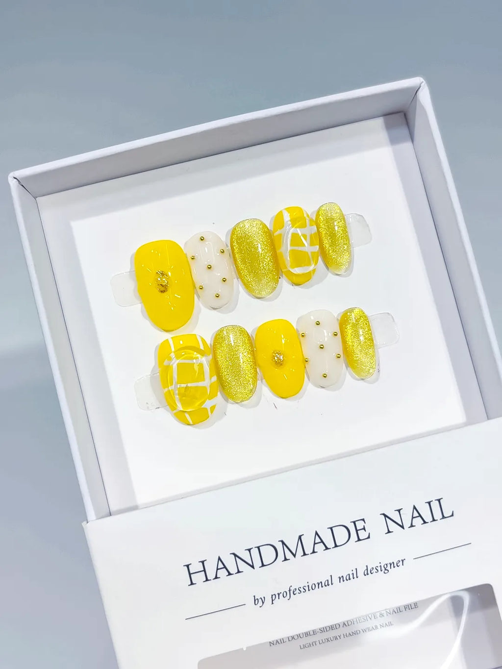 Yellow White Gold Glitter Grid Pattern Stud press on nails angled view