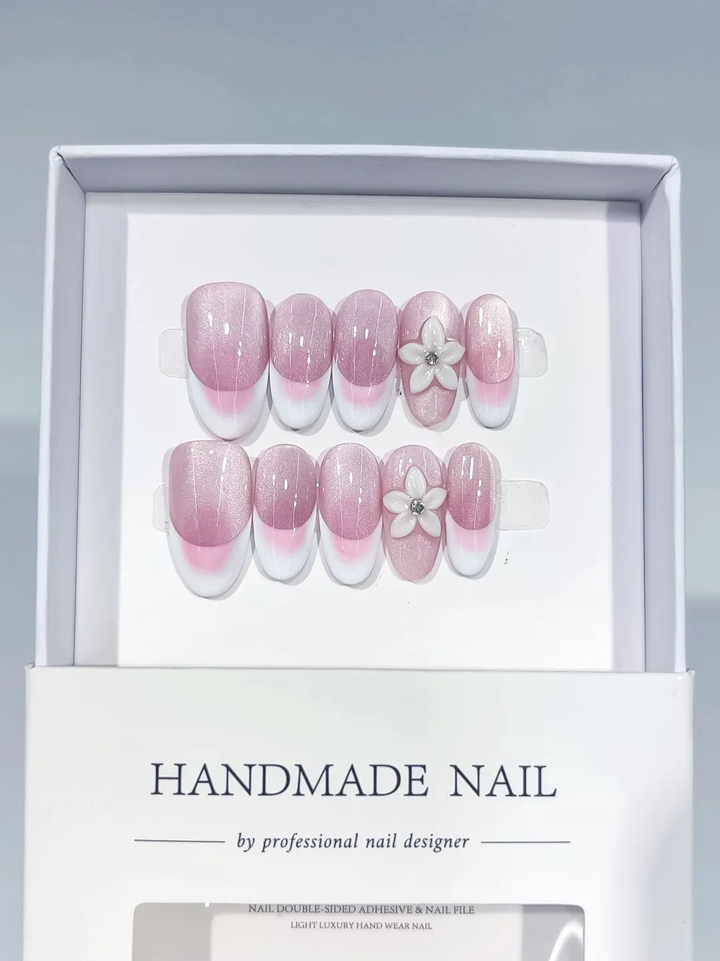 Pink White French tip Flower press on nails angled view