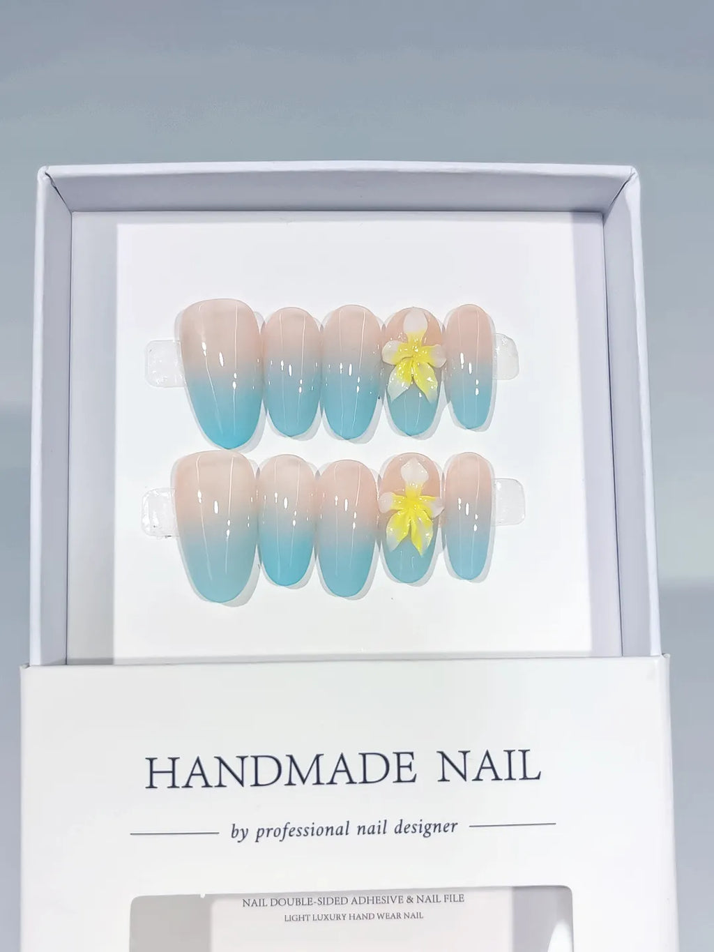 Nude Blue Yellow Ombre Flower press on nails angled view