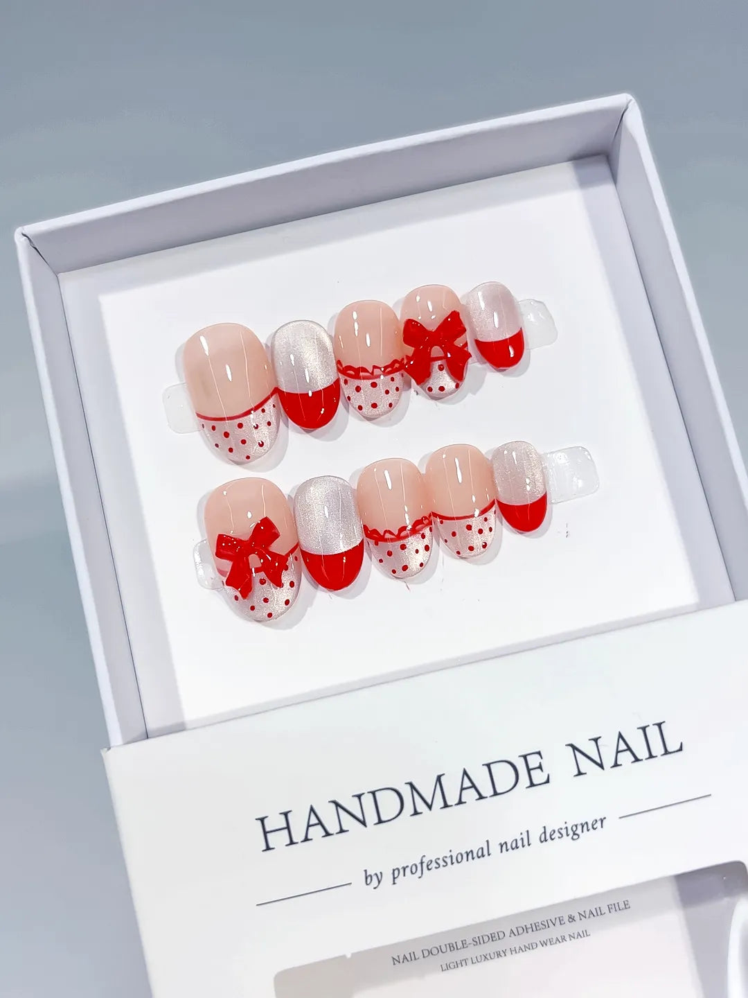 White Red Silver French tip Bow Polka Dot press on nails angled view