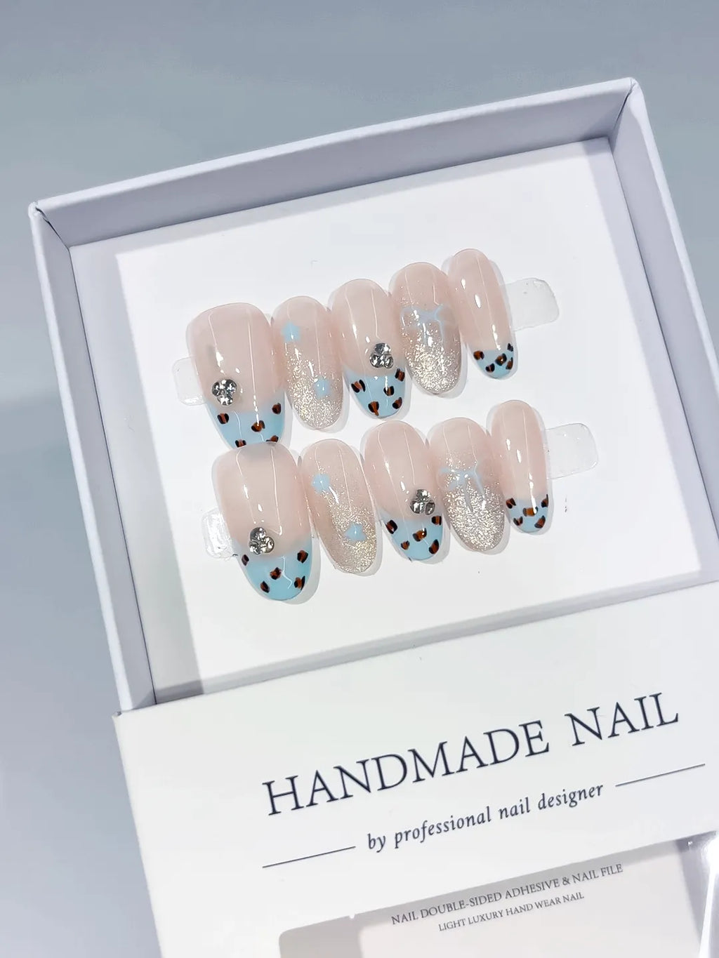 Nude Blue Silver French tip Animal Print Glitter Rhinestone press on nails angled view