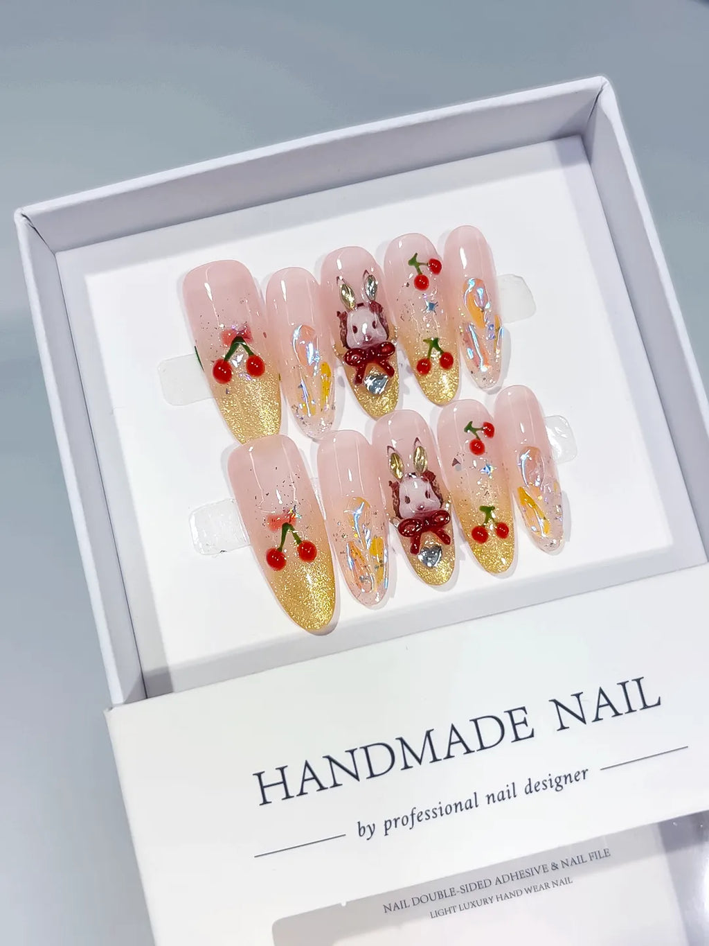 Nude Gold Red Glitter Cherry Bunny Aurora press on nails angled view