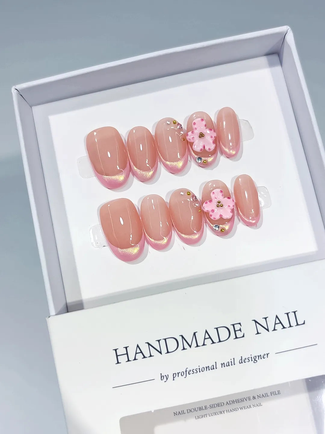Nude Pink Gold French tip Heart Rhinestone press on nails angled view