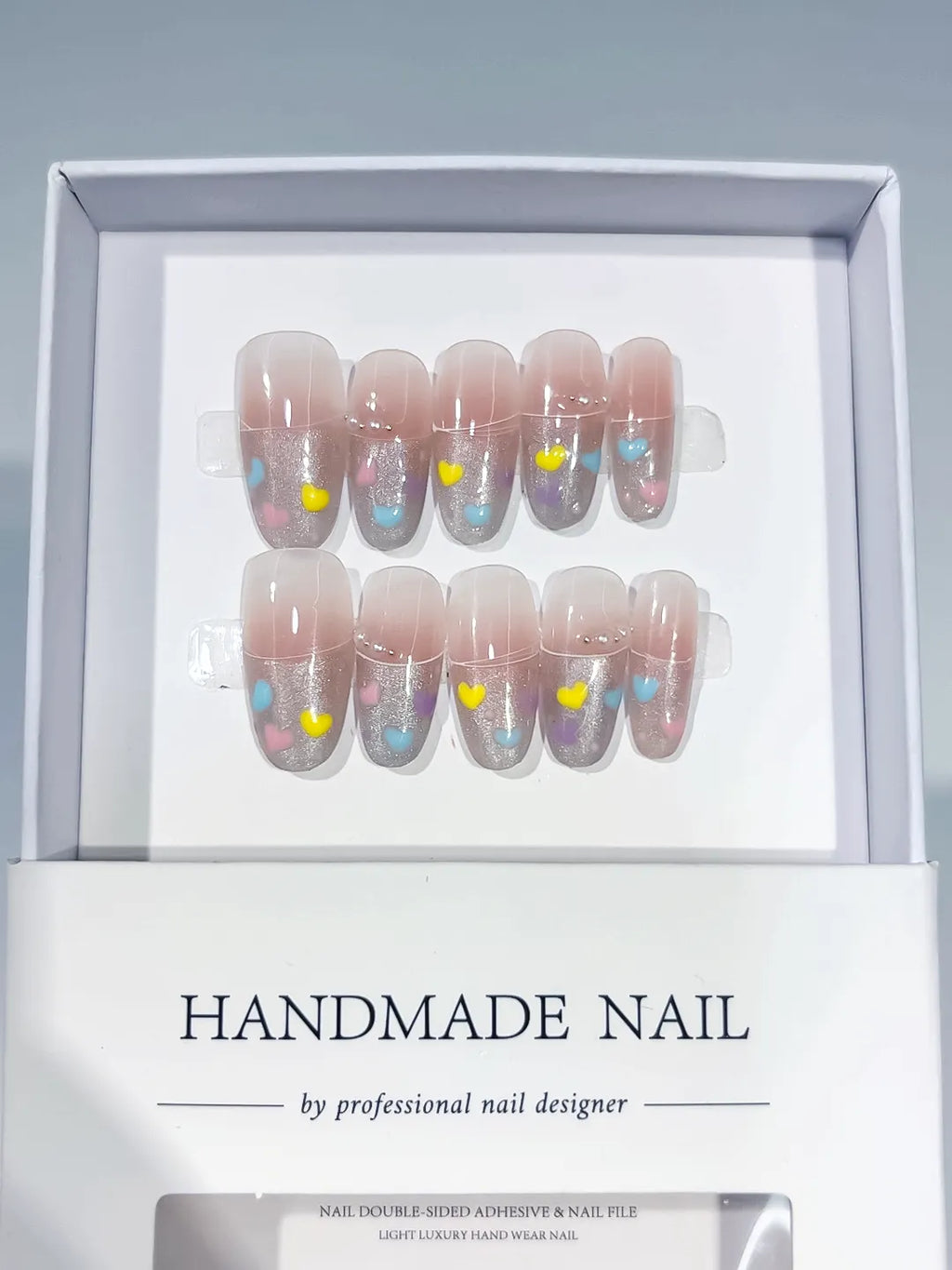 Nude Silver Blue Yellow Glitter Heart press on nails angled view