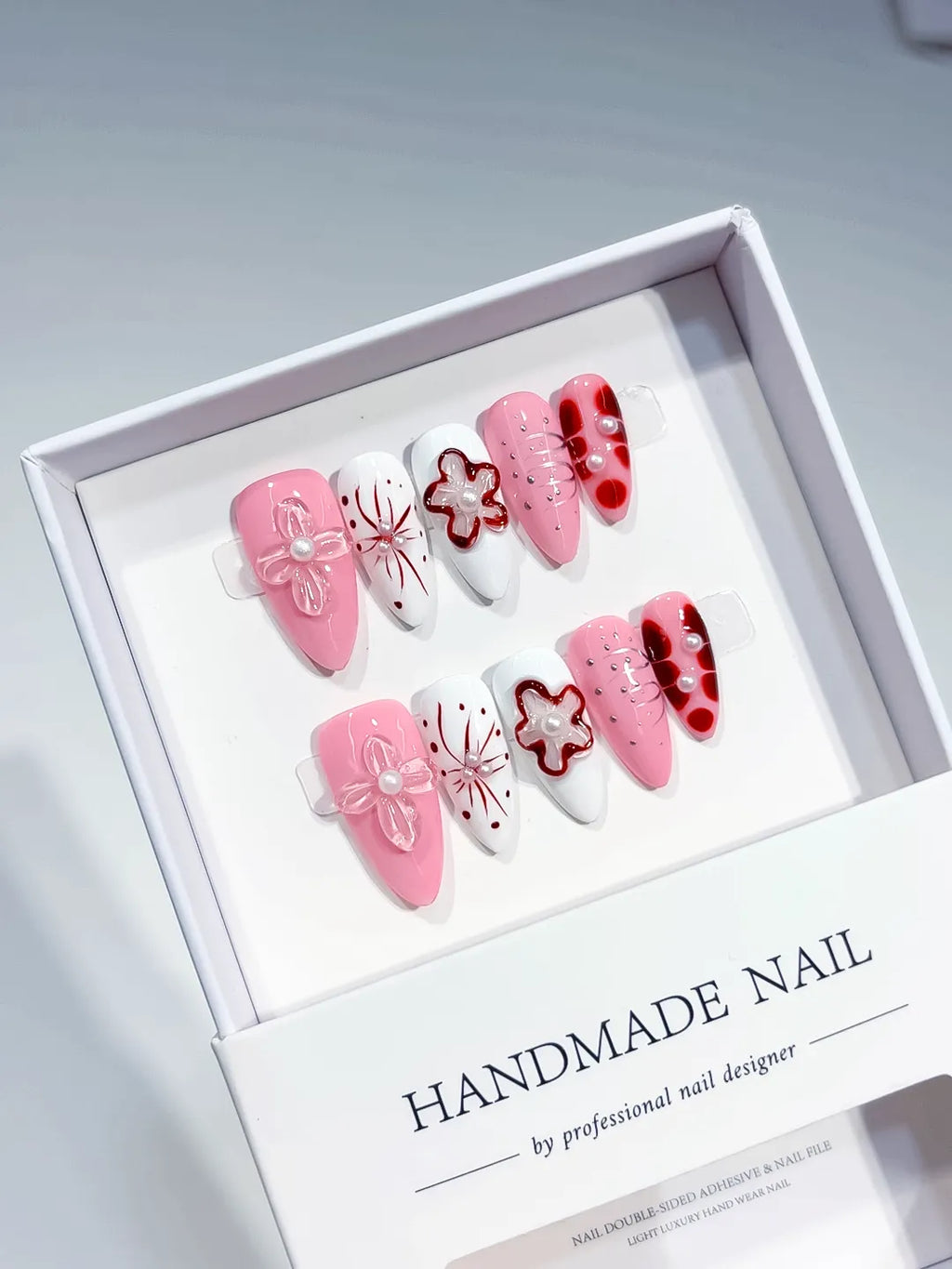 Pink White Red Abstract Bow Flower Pearl press on nails angled view